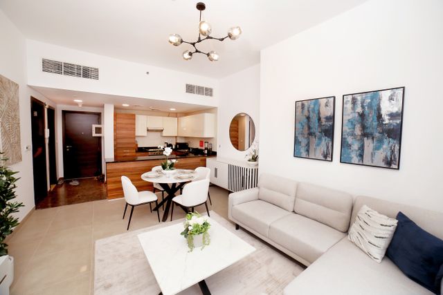 contemporary apartment living room with an open kitchen